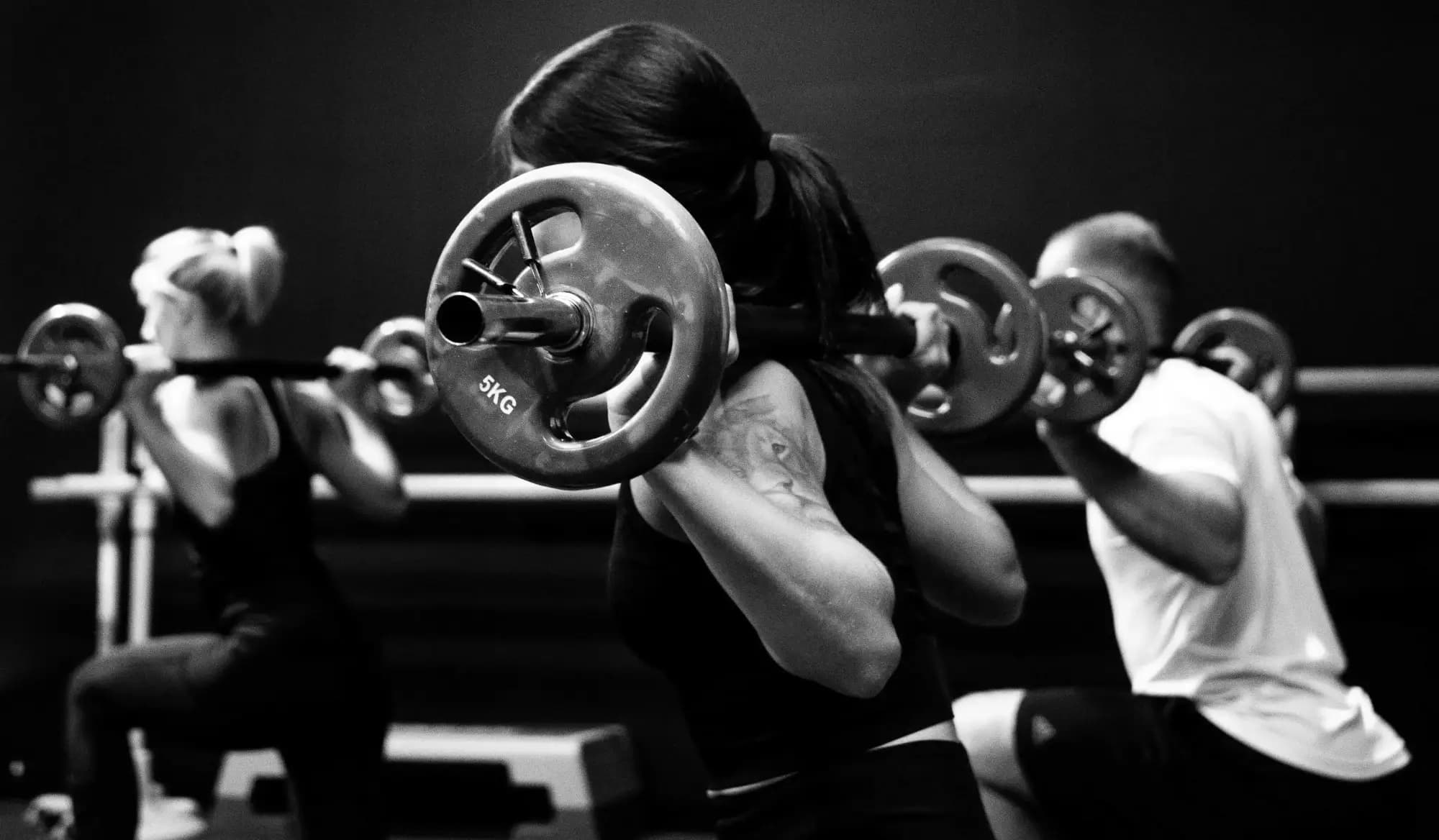 People doing weight training in a fitness class