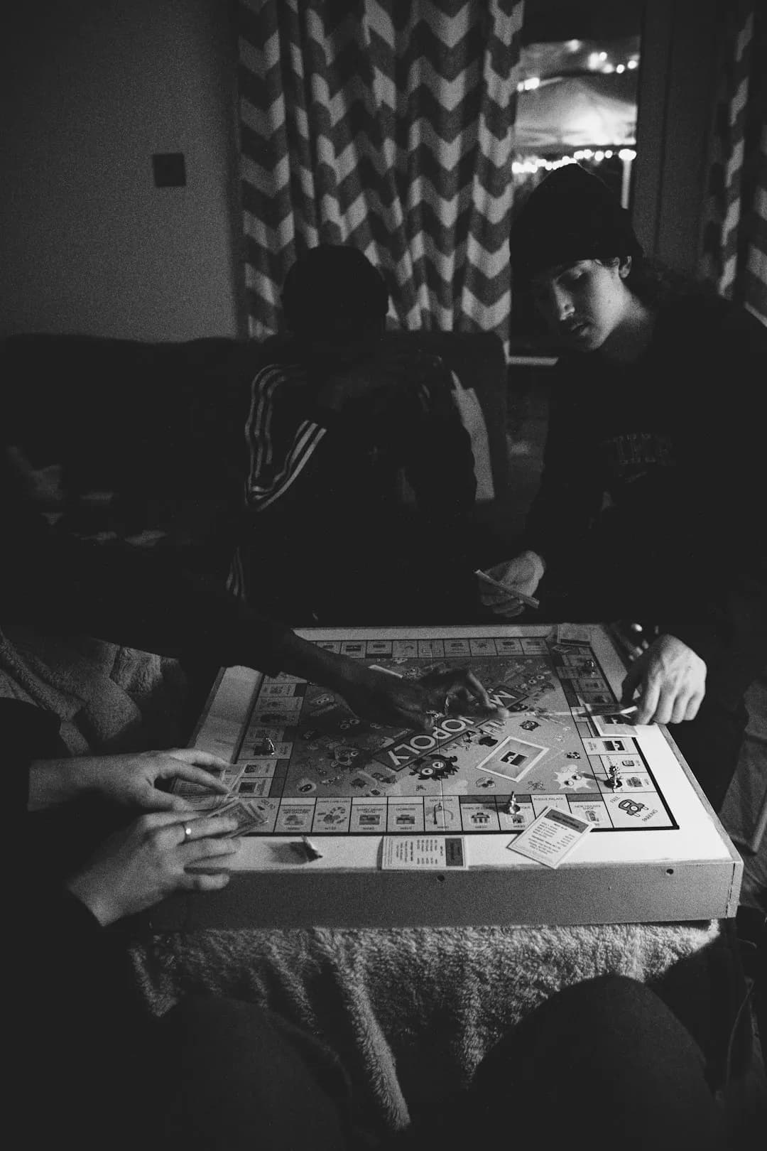 Couple playing a board game together at home