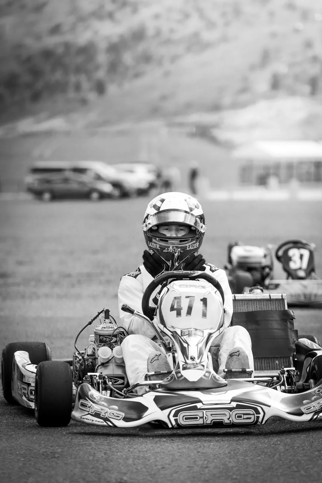Racer driving go-kart on track