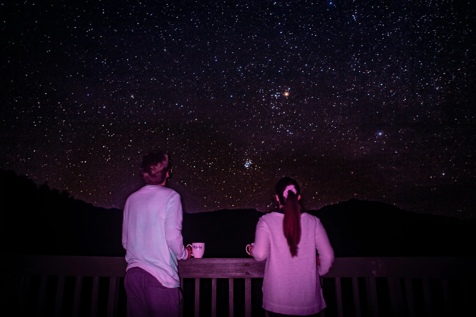 Couple standing together looking at the stars