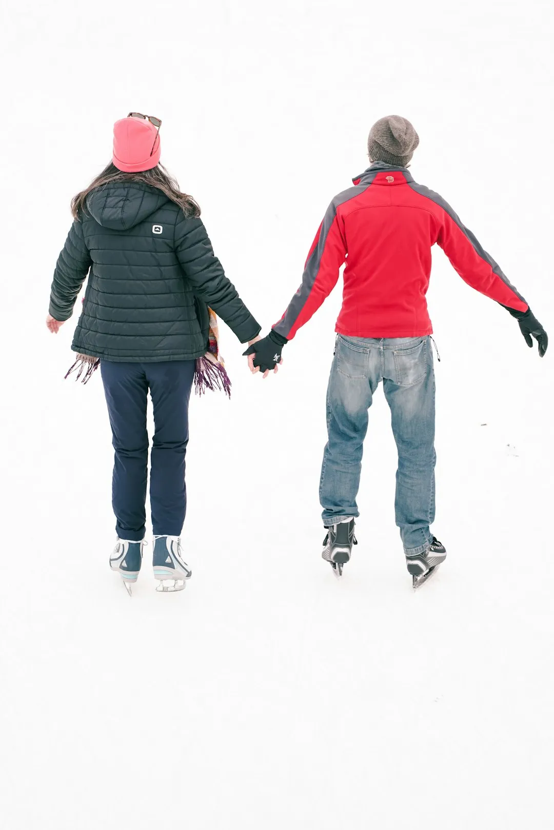 Couple ice skating together