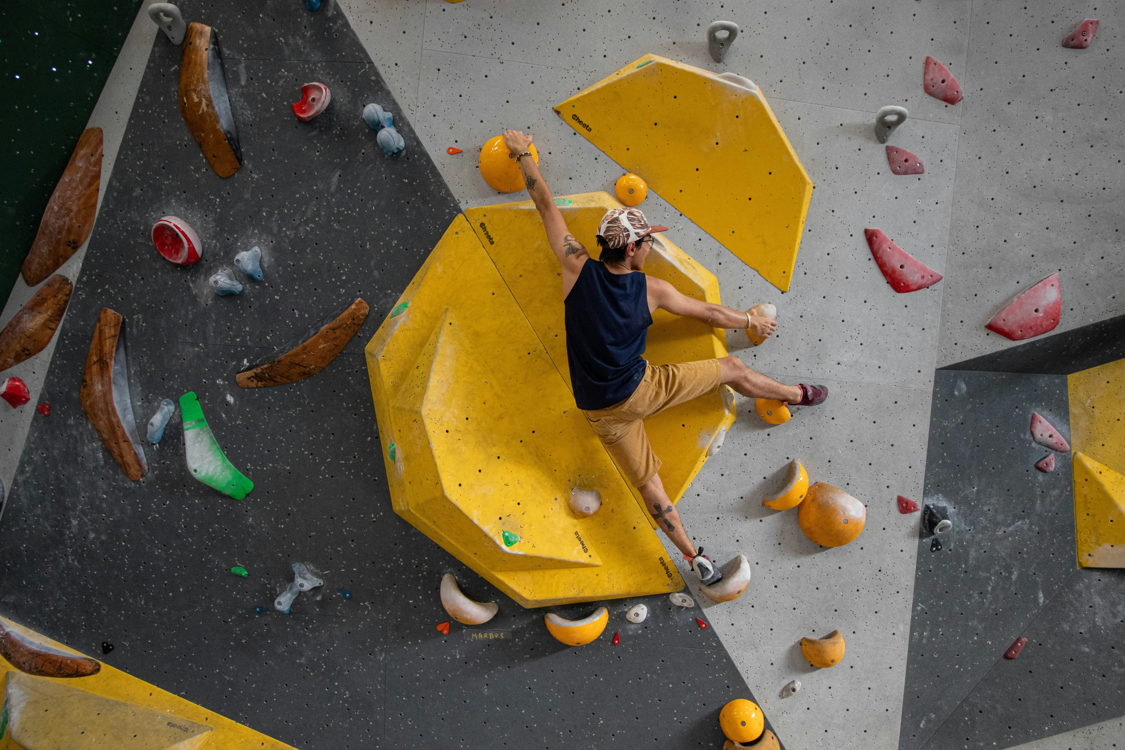 Man doing indoor rock climbing