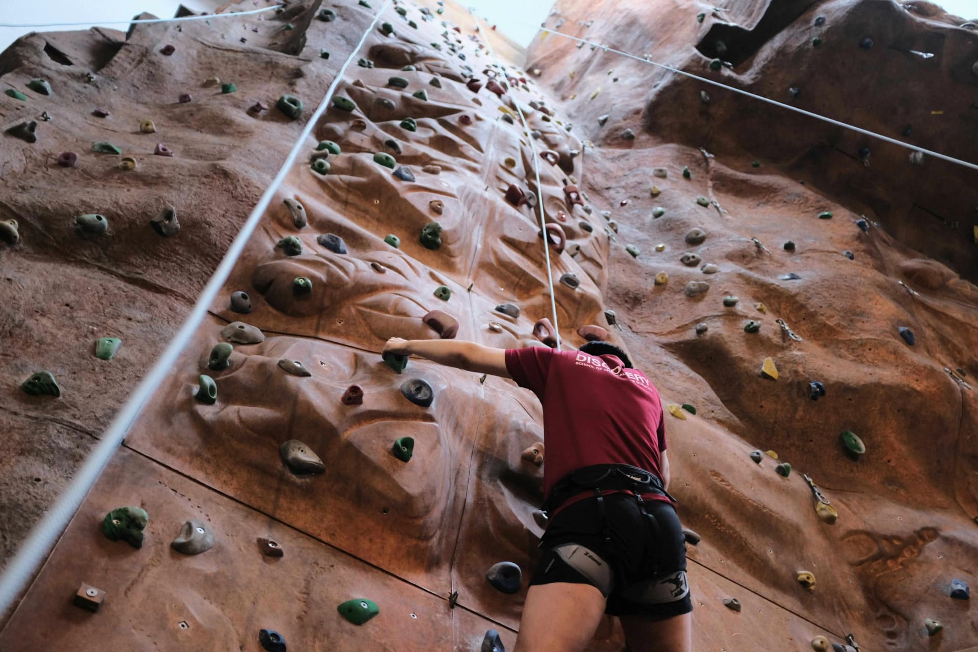 Person doing indoor rock climbing