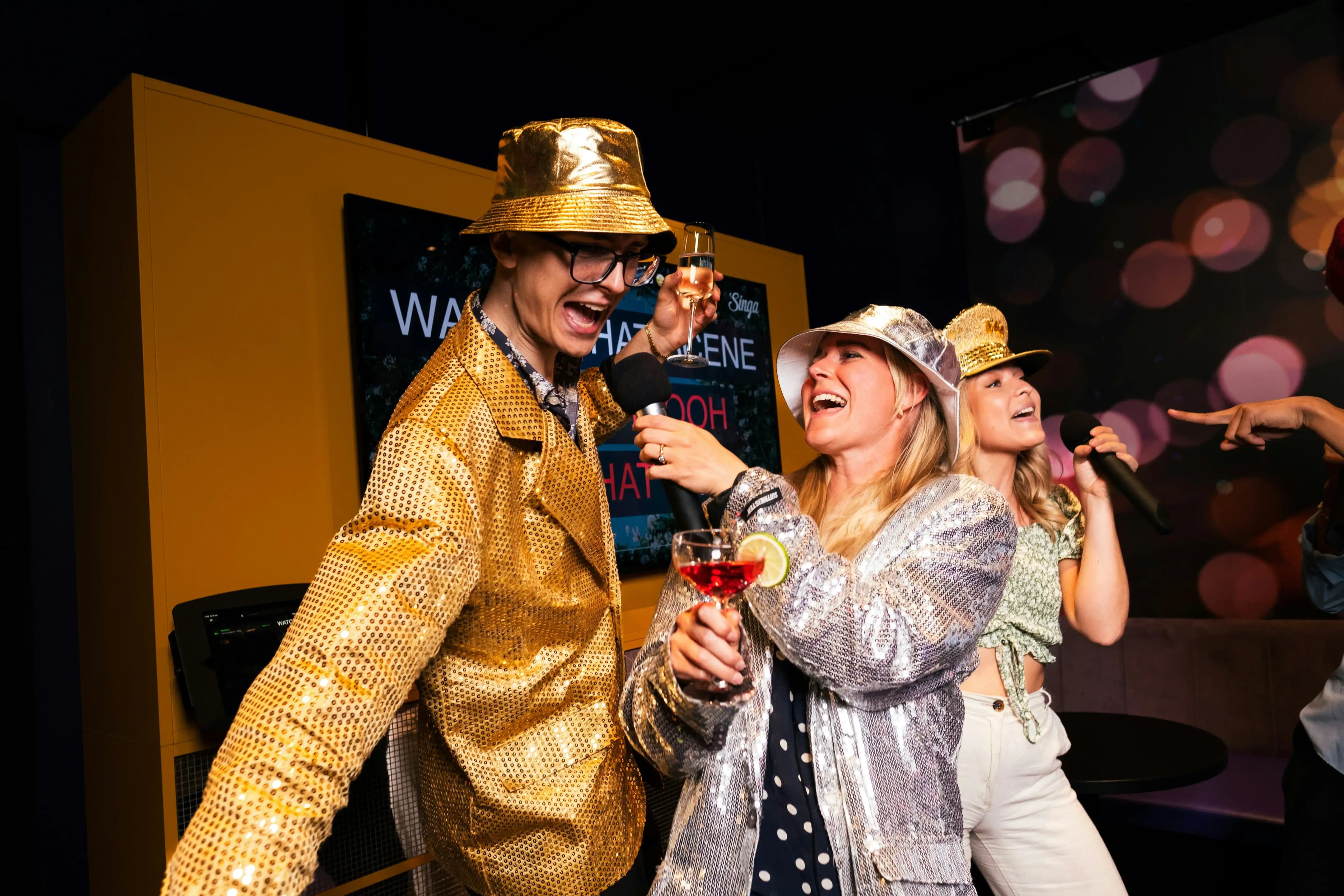 People singing karaoke and having fun at a karaoke night