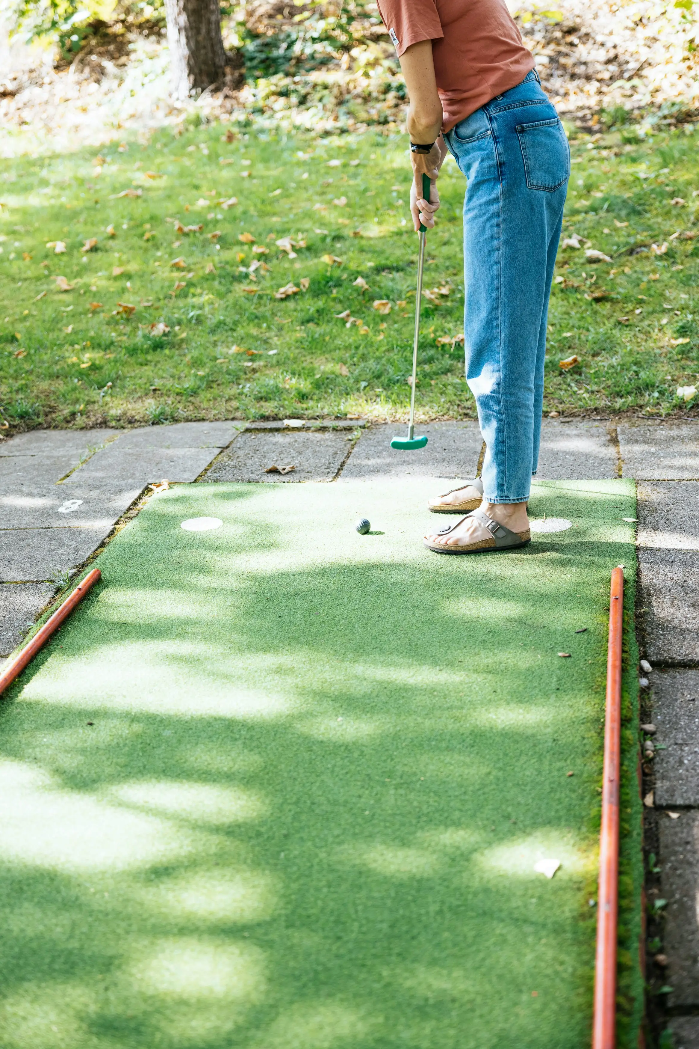 Woman enjoying mini golf on a date