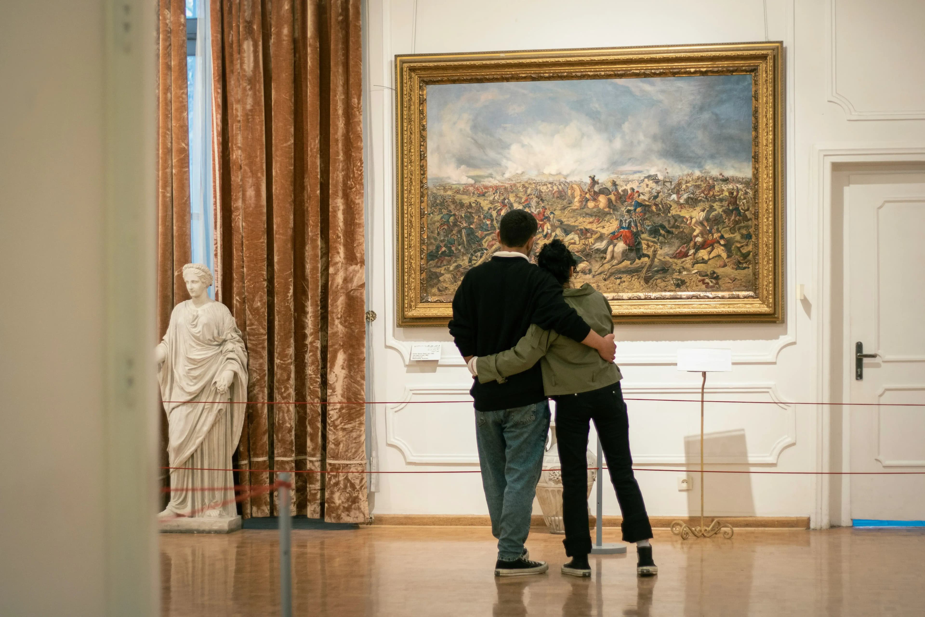 Couple enjoying art at a museum date