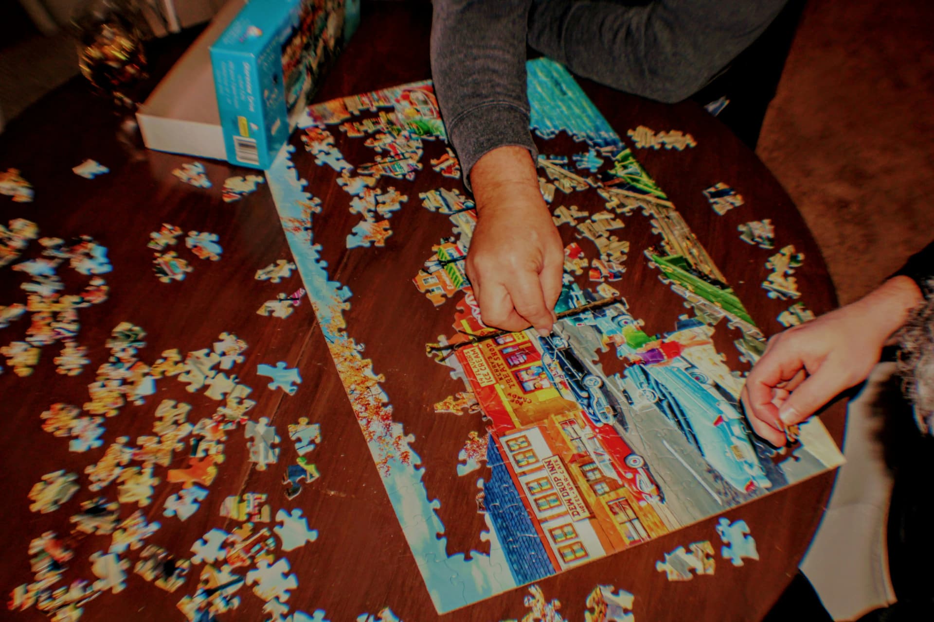 Couple working on jigsaw puzzle together on date night