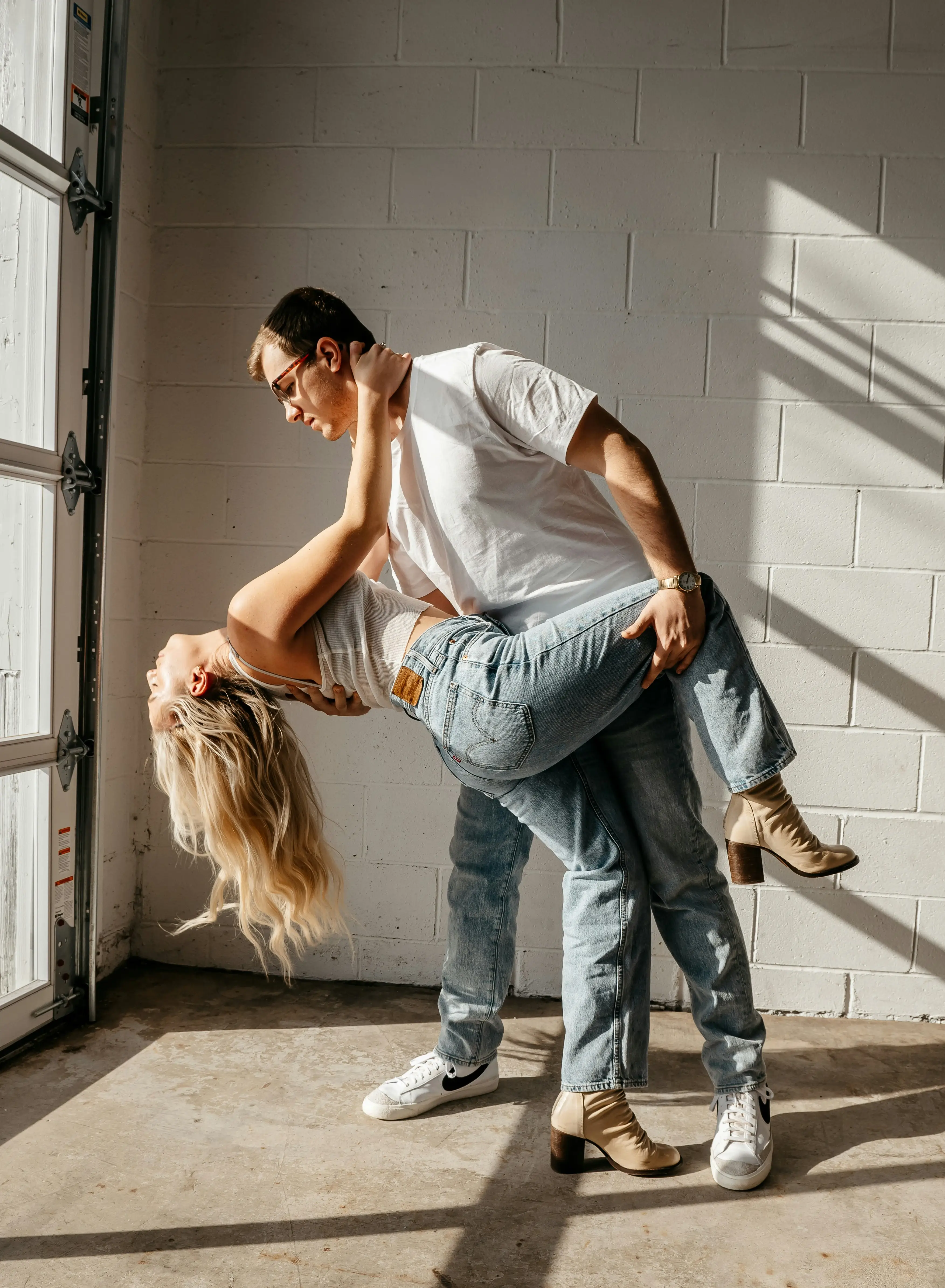 Couple dancing close together in their home