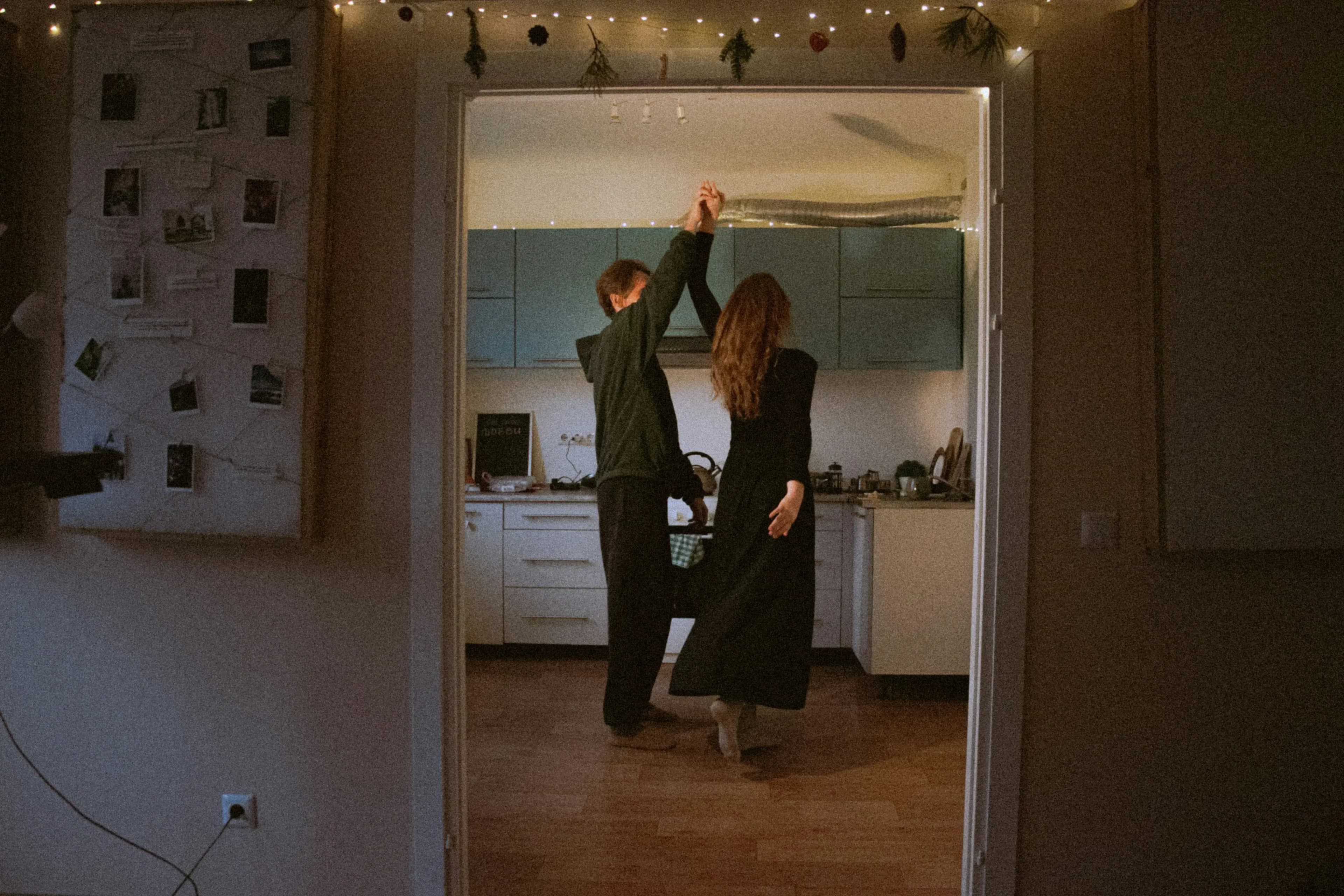 Couple slow dancing together at home